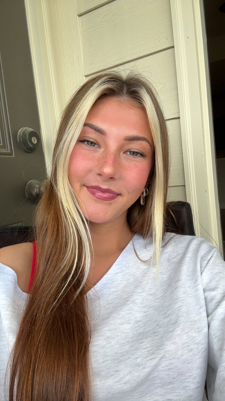 Ella smiling by the front door